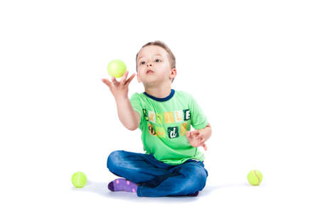boy catches the ball on a white backgroundの写真素材