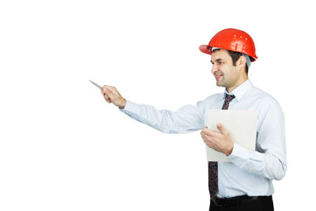 man engineer in a red helmet shows his penの写真素材