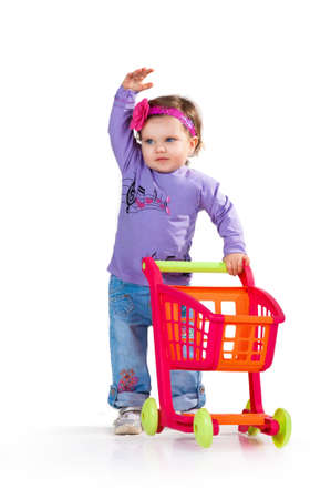 little girl goes to the shopping cartの写真素材