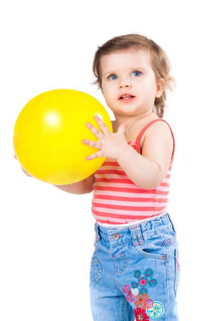 a little girl, a child with a yellow balloonの写真素材
