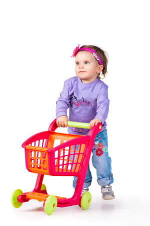 little girl goes to the shopping cartの写真素材