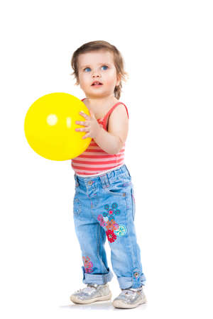 a little girl, a child with a yellow balloonの写真素材