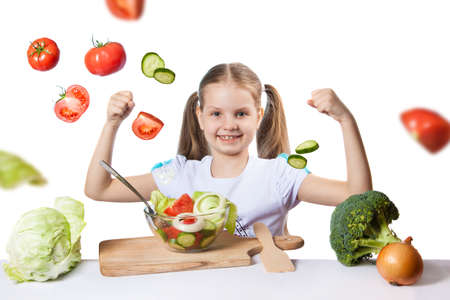 Beautiful girl with fresh vegetablesの写真素材