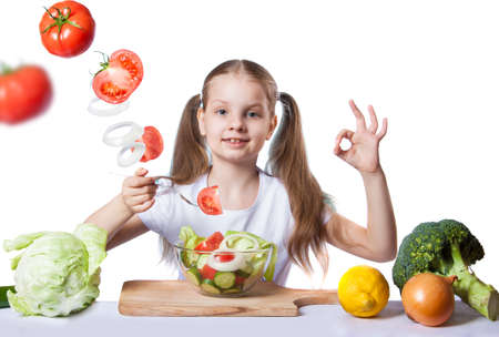 Beautiful girl with fresh vegetablesの写真素材