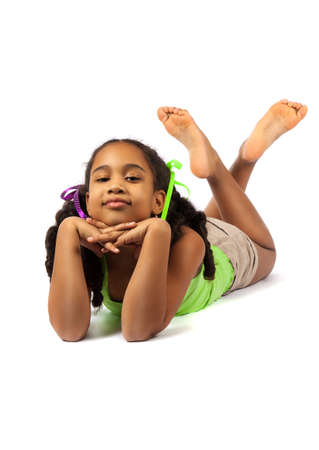 Cute little girl lie on the floorの写真素材