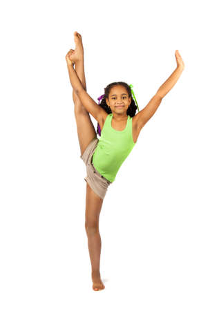 girl gymnast on the training. Isolation on a white backgroundの写真素材