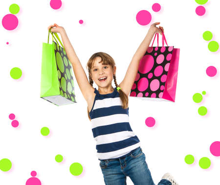 happy teenage girl with shopping bags Isolation on the whiteの写真素材