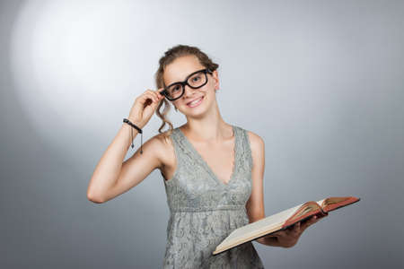 Teen girl with book corrects Pointsの写真素材