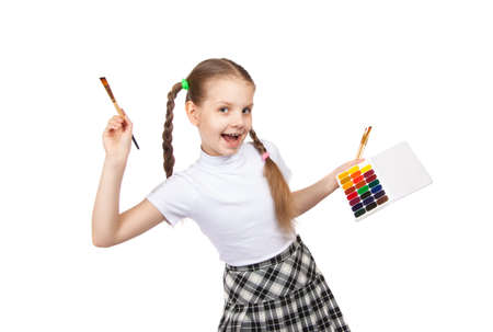 Portrait of happy girls. Schoolgirl draws paints  Isolation on a white background.の写真素材