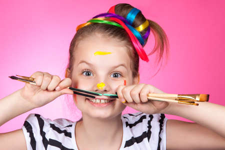 child and creativity, development. Portrait of a cheerful girl creativeの写真素材