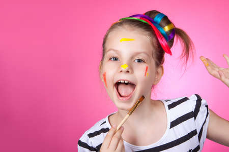 child and creativity, development. Portrait of a cheerful girl creativeの写真素材