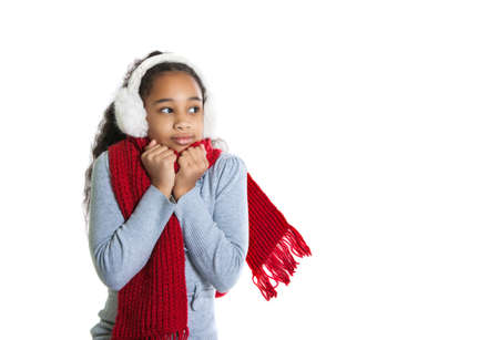 A beautiful dark-skinned girl in a red scarf. Cold. Girl frozeの写真素材