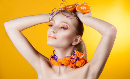 Creative make-up and hairstyle. Portrait of young girlの写真素材