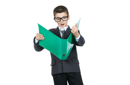 Surprised boy student holding a folder with the task. Boy in shock isolated on white background