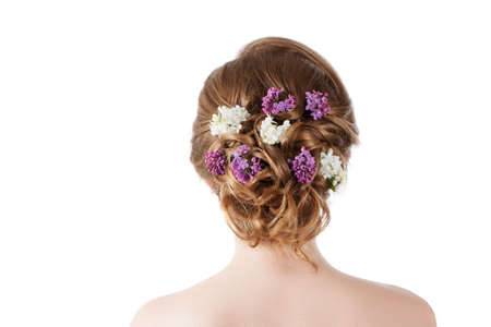Beauty fashion model Girl with Lilac Flowers Hairstyle. Girl standing back. Isolation on a white backgroundの写真素材