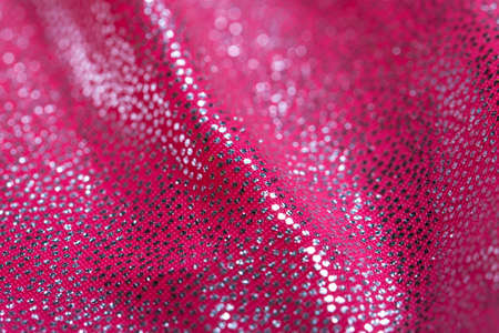 Close-up fabric. texture. covered with reflective dots that give the image its glitter.の写真素材