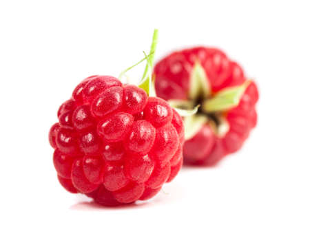 ripe raspberries on white background. Red juicy berries closeup. Stock photos.