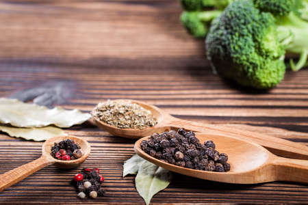 Spices and herbs closeup on a wooden table. Empty space for textの写真素材