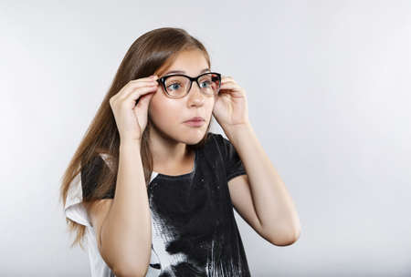 Funny girl with glasses. Human emotions. Surpriseの写真素材
