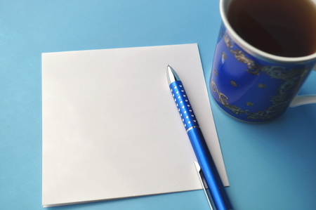 Styled stock image of blue and green color pencils in a blue china cup on grey with copy spaceの写真素材