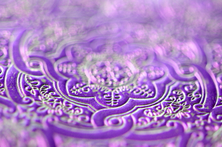 Dark ultra violet lavender with silver and gold ornamental filigree pattern in metallic vivid color with blurred background and selective focus.  Background for text or copy space.の写真素材