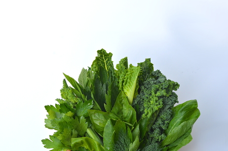 Top view flat layout of fresh culinary herbs and green leafy vegetables with copy space. Background for nutrition, food, health, cooking, diet and weight loss themes.の写真素材