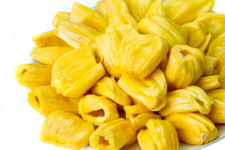 pile of ripe jackfruit on dish with white backgroundの写真素材