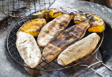 Sweet Potatoes and Pumpkins grilled on stoveの写真素材
