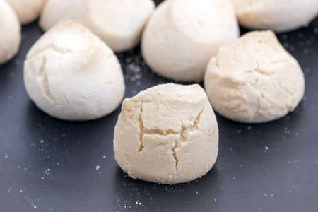 Khanom Ping - Thai sweetmeat made of flour, egg and sugar with sweet smell on black dish.の写真素材