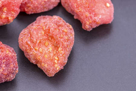 Dehydrated(dried) organic ripe Strawberry on black plateの写真素材