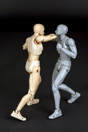 Attacker punches straight. Defender steps diagonally in, parries with left arm, and lands an upward elbow to the attackerâs chin.の写真素材