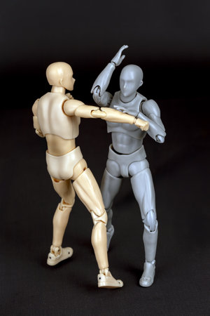 Attacker punches right. Defender steps in, parries with left, then strikes the right shoulder with a sharp right elbow.の写真素材