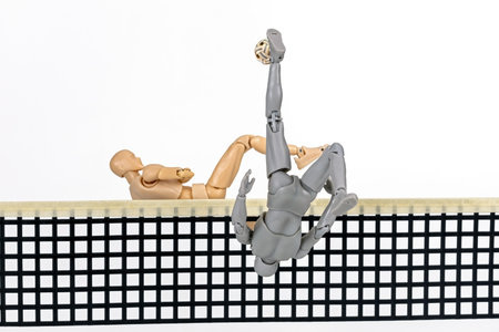 Attacker figurine performs dynamic full somersault spike and blocking in sepak takraw, showcasing agility and balance. figure is mid air, emphasizing athleticism and motion against white backgroundの写真素材