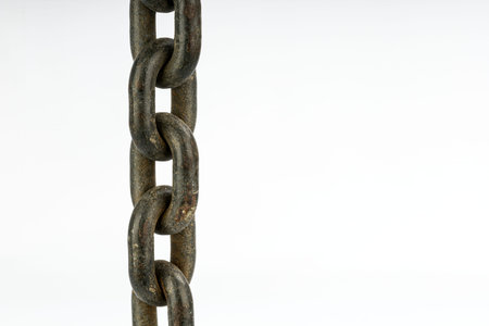 A detailed close-up of a metal chain, showcasing its links and texture. The chain is presented...