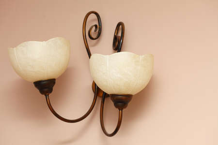 vintage Lamp on the wall pink background