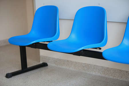 waiting room blue chairs, door on the floorの写真素材