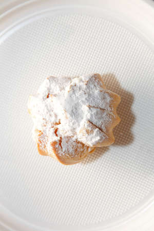 profiteroles choux pastry bun with whipped cream on a plateの写真素材