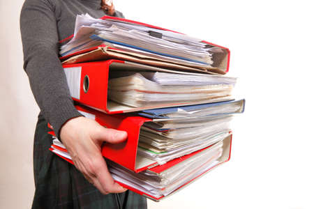 woman in grey holding stack of folders. Pile with old documents and bills. Isolated on white...