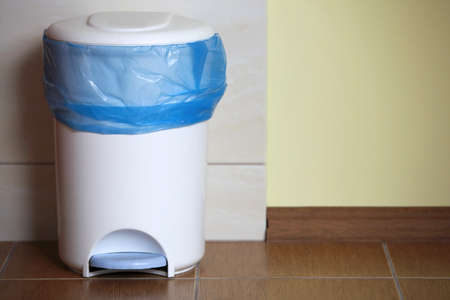 trash can with a plastic bag inside indoorの写真素材