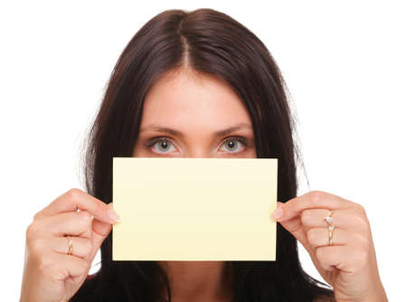 Gift card. Excited woman showing empty blank paper card sign female model isolatedの写真素材