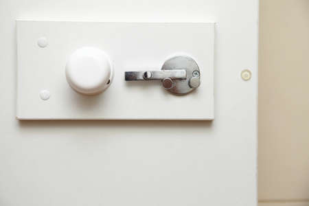 lock latch on bathroom white doorの写真素材