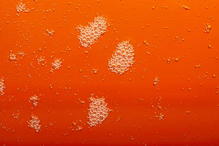 closeup - orange motor oil with bubbles texture background