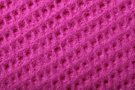 Pink kitchen sponge rubber foam as background textureの写真素材