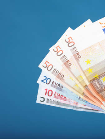 european currency euro banknotes on blue backgroundの写真素材