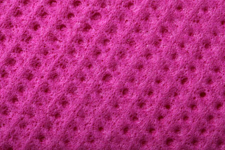 Pink kitchen sponge rubber foam as background textureの写真素材