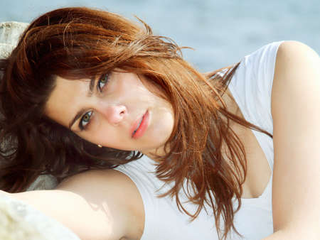 young woman on beach enjoying summer holiday