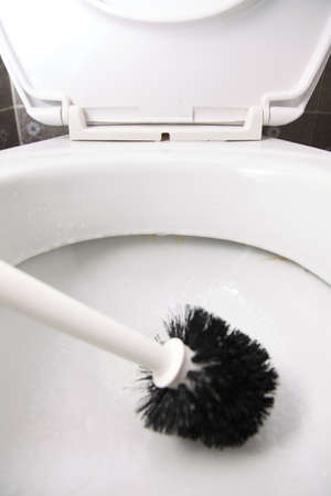 cleaning a toilet bowl with brush. Clean up your house.の写真素材
