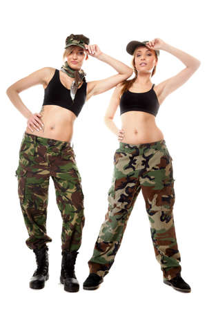 Full length two women in military clothes army girls isolated on white background.の写真素材