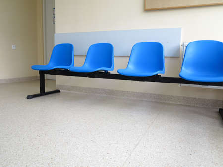 Interior of a waiting room blue stools, empty chairs.の写真素材