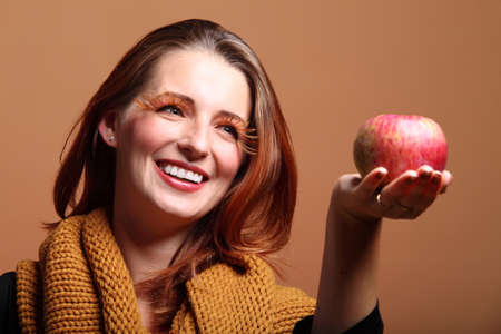 Autumn woman apple fashion female, fresh girl glamour eye-lashesの写真素材
